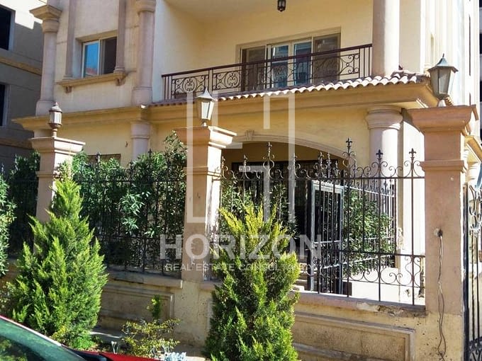 Ground floor with garden for sale in front of AUC New Cairo