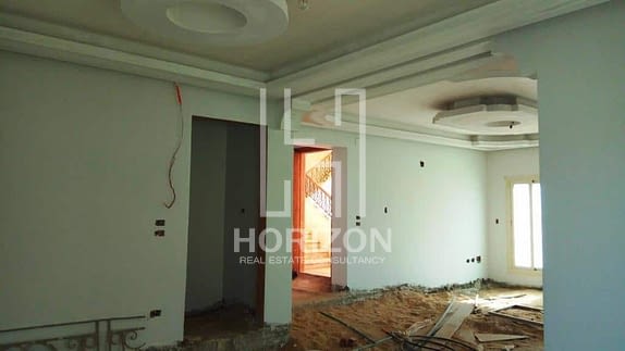 Ground floor with garden for sale in front of AUC New Cairo